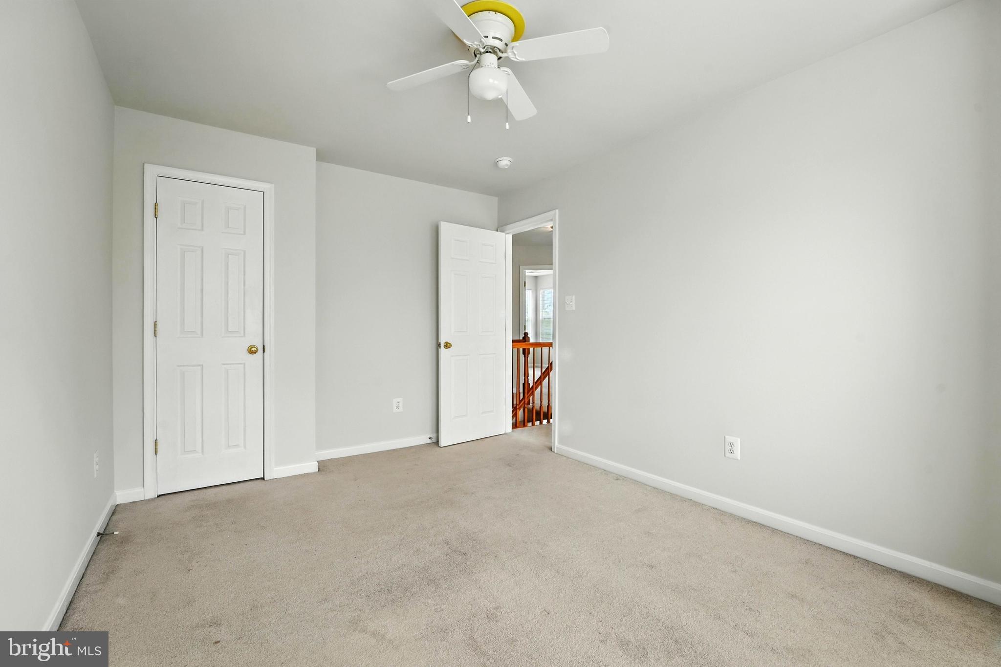 705 Holly Leaf Road Culpeper, VA 22701 - Photo 30 of 62 an empty room with chandelier fan and window
