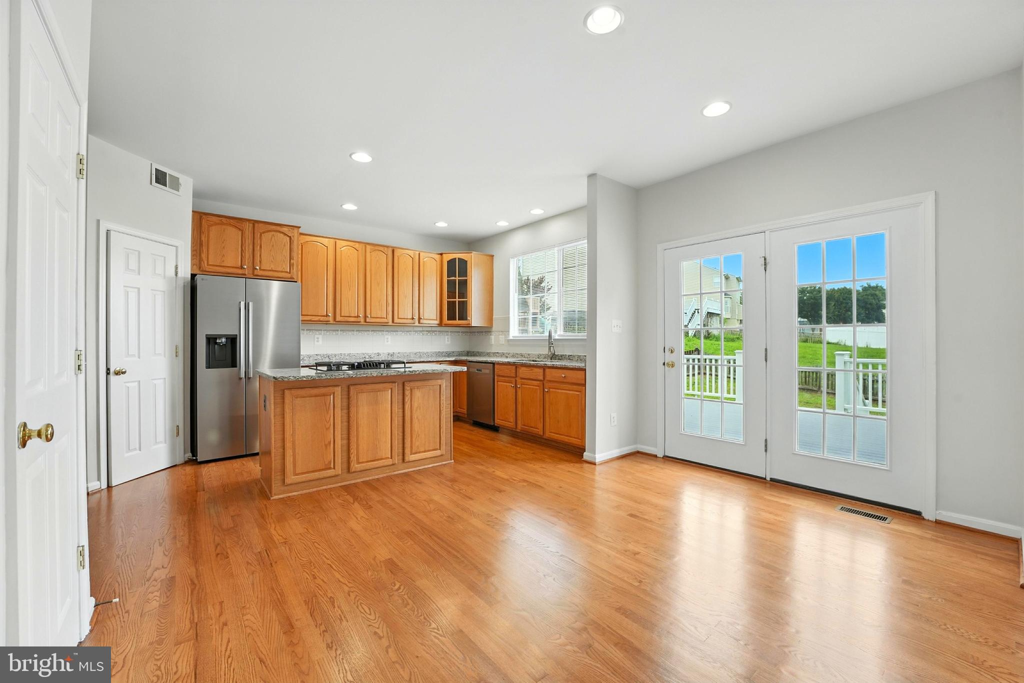 705 Holly Leaf Road Culpeper, VA 22701 - Photo 4 of 62 a large kitchen with stainless steel appliances granite countertop a granite counter tops and a window