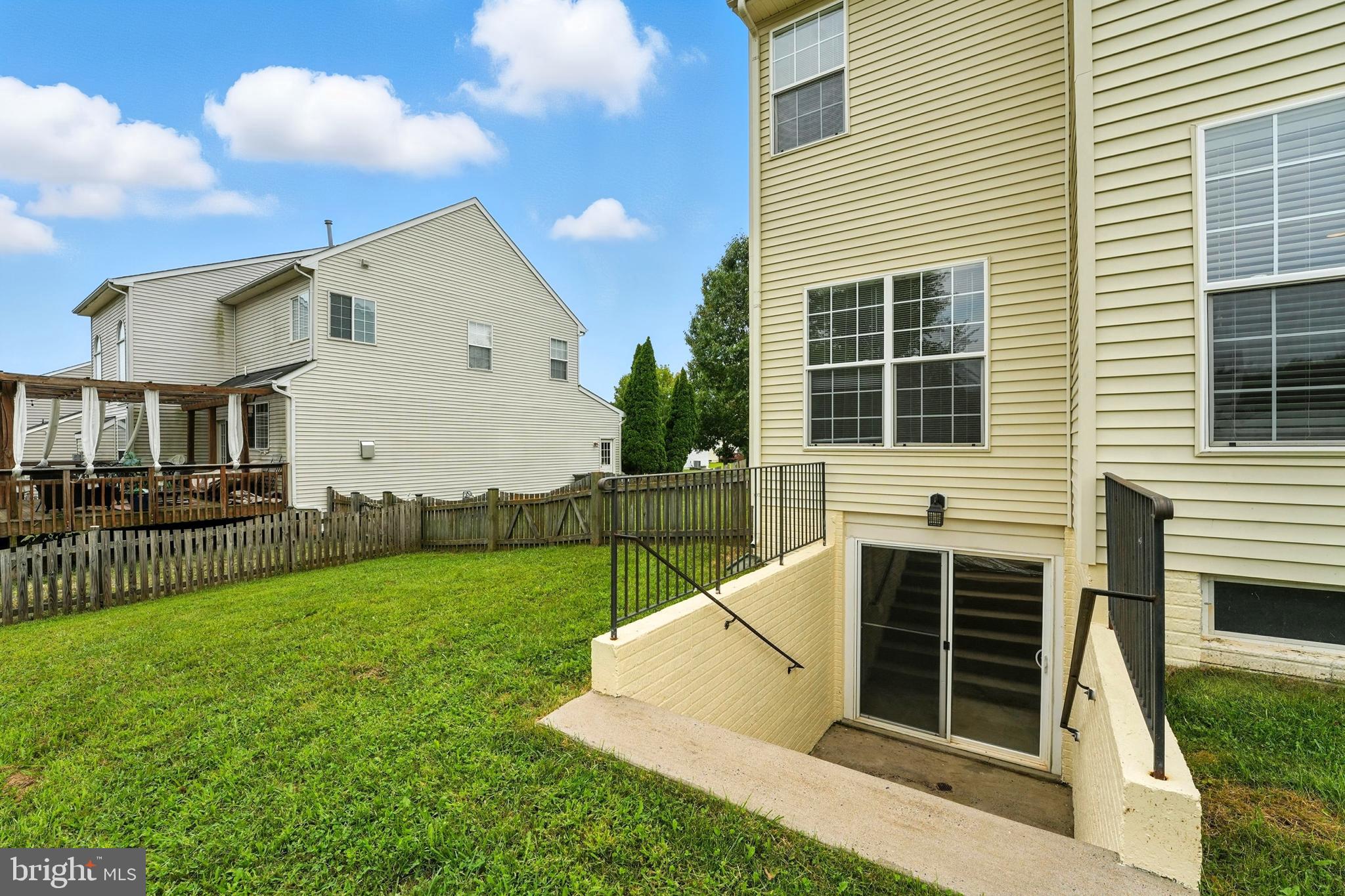 705 Holly Leaf Road Culpeper, VA 22701 - Photo 49 of 62 a view of backyard with barbeque grill and wooden fence