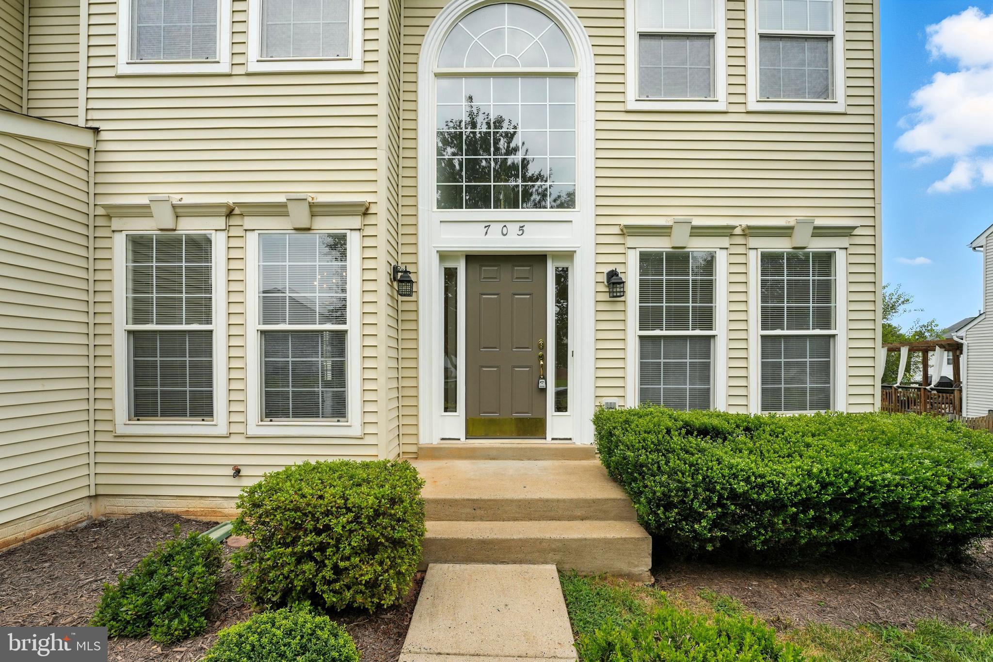 705 Holly Leaf Road Culpeper, VA 22701 - Photo 57 of 62 a front view of a house with a garden