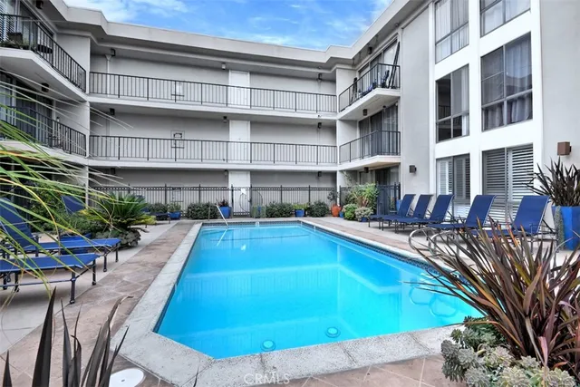 a view of a swimming pool with a lounge chair