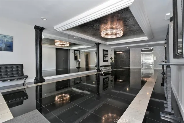 a view of a hallway with seating area