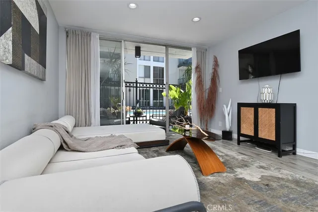 a living room with fireplace furniture and a flat screen tv