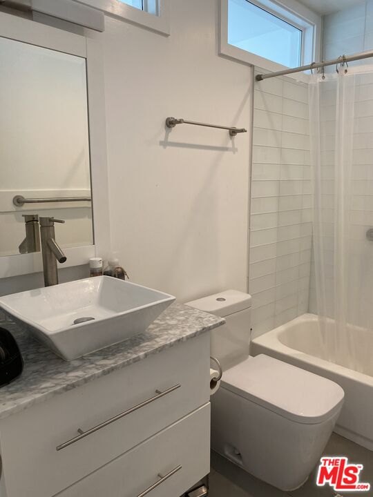 23901 Civic Center Way, Unit 114 Malibu, CA 90265 - Photo 26 of 38 a bathroom with a sink and a mirror