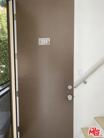 a view of a house with swimming pool and sitting area