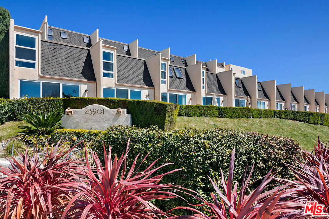 23901 Civic Center Way, Unit 114 Malibu, CA 90265 - Photo 38 of 38 a front view of a house with a garden