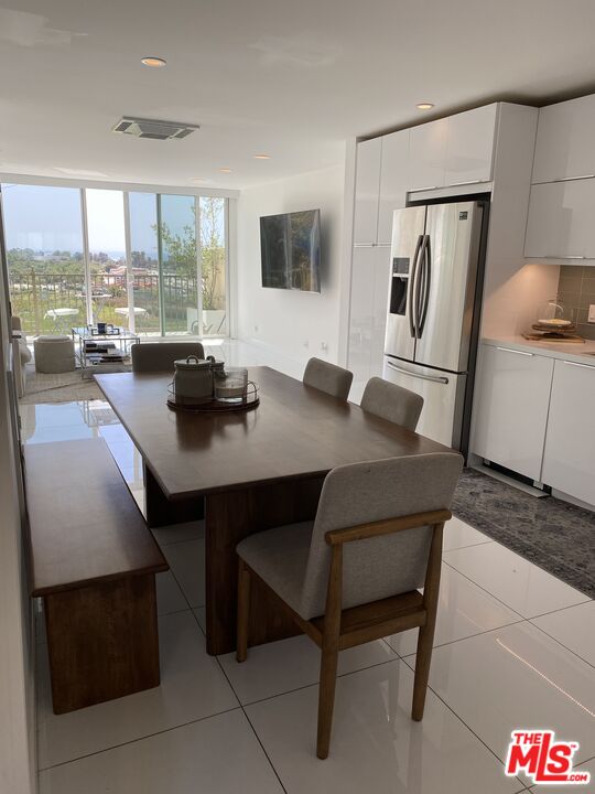 23901 Civic Center Way, Unit 114 Malibu, CA 90265 - Photo 4 of 38 a view of a dining room with furniture window and outside view