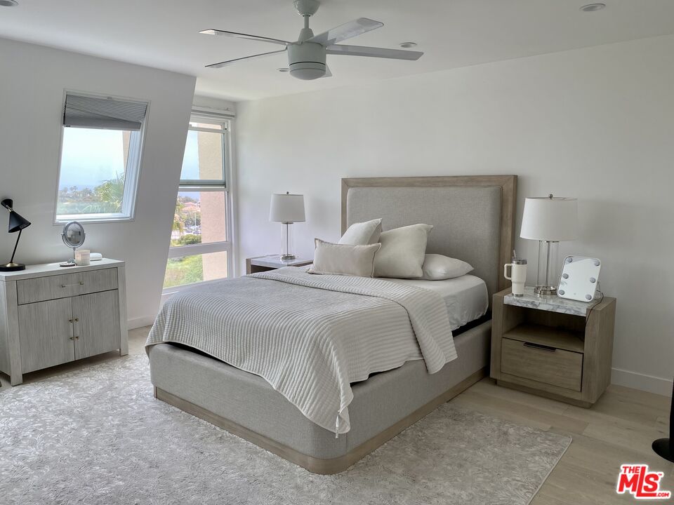 23901 Civic Center Way, Unit 114 Malibu, CA 90265 - Photo 7 of 38 a spacious bedroom with a bed and a table