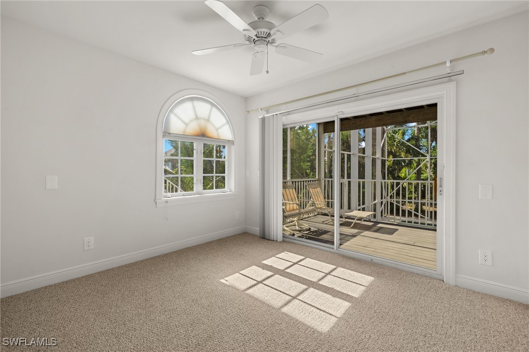 431 Rabbit Road Sanibel, FL 33957 - Photo 14 of 41 an empty room with windows and fan