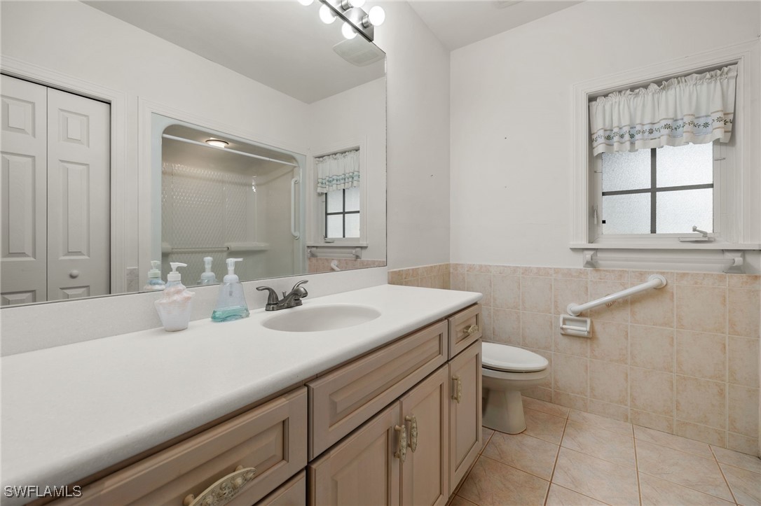 431 Rabbit Road Sanibel, FL 33957 - Photo 17 of 41 a bathroom with a sink toilet and mirror