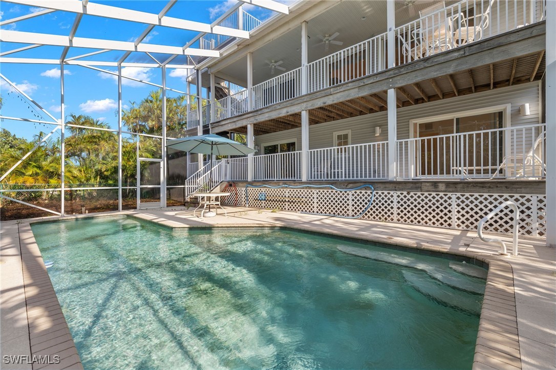 431 Rabbit Road Sanibel, FL 33957 - Photo 25 of 41 a view of a house with a backyard