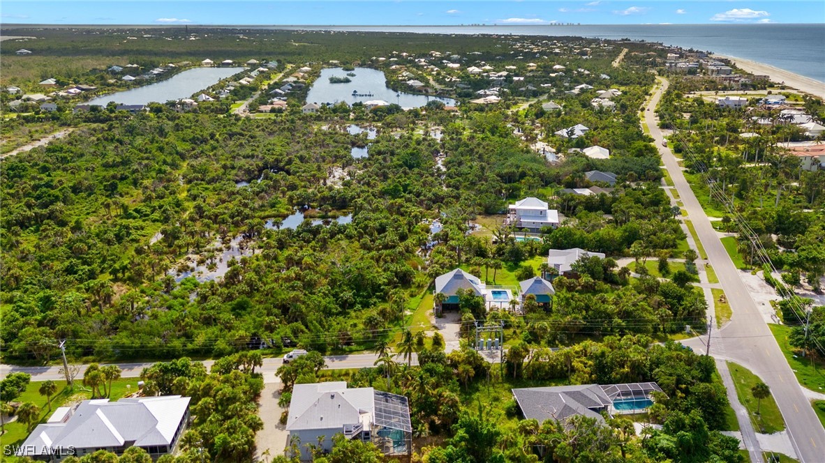 431 Rabbit Road Sanibel, FL 33957 - Photo 37 of 41 an aerial view of residential houses with outdoor space and trees