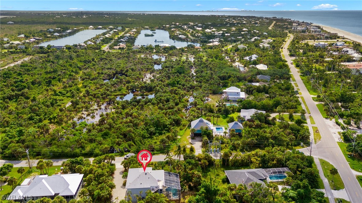 431 Rabbit Road Sanibel, FL 33957 - Photo 38 of 41 an aerial view of residential houses with outdoor space and swimming pool