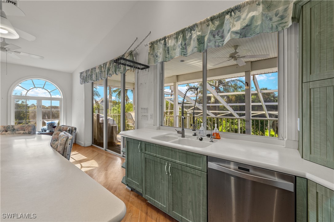 431 Rabbit Road Sanibel, FL 33957 - Photo 8 of 41 a kitchen with a sink and large windows