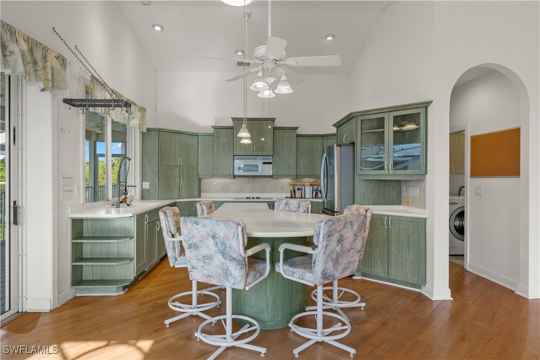 431 Rabbit Road Sanibel, FL 33957 - Photo 9 of 41 a view of a dining room with furniture and wooden floor