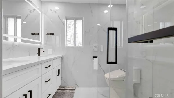 a bathroom with a shower and a mirror
