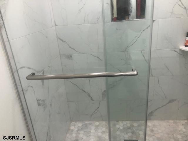 203 East Brigantine Avenue, Unit 206 Brigantine, NJ 08203 - Photo 12 of 14 a bathroom with a shower