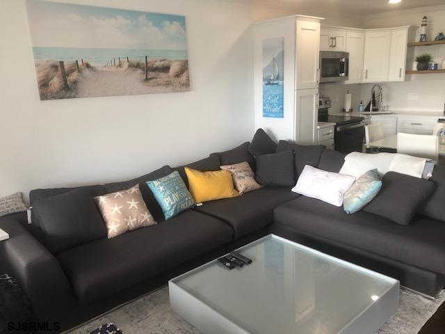 203 East Brigantine Avenue, Unit 206 Brigantine, NJ 08203 - Photo 6 of 14 a living room with furniture and a couch