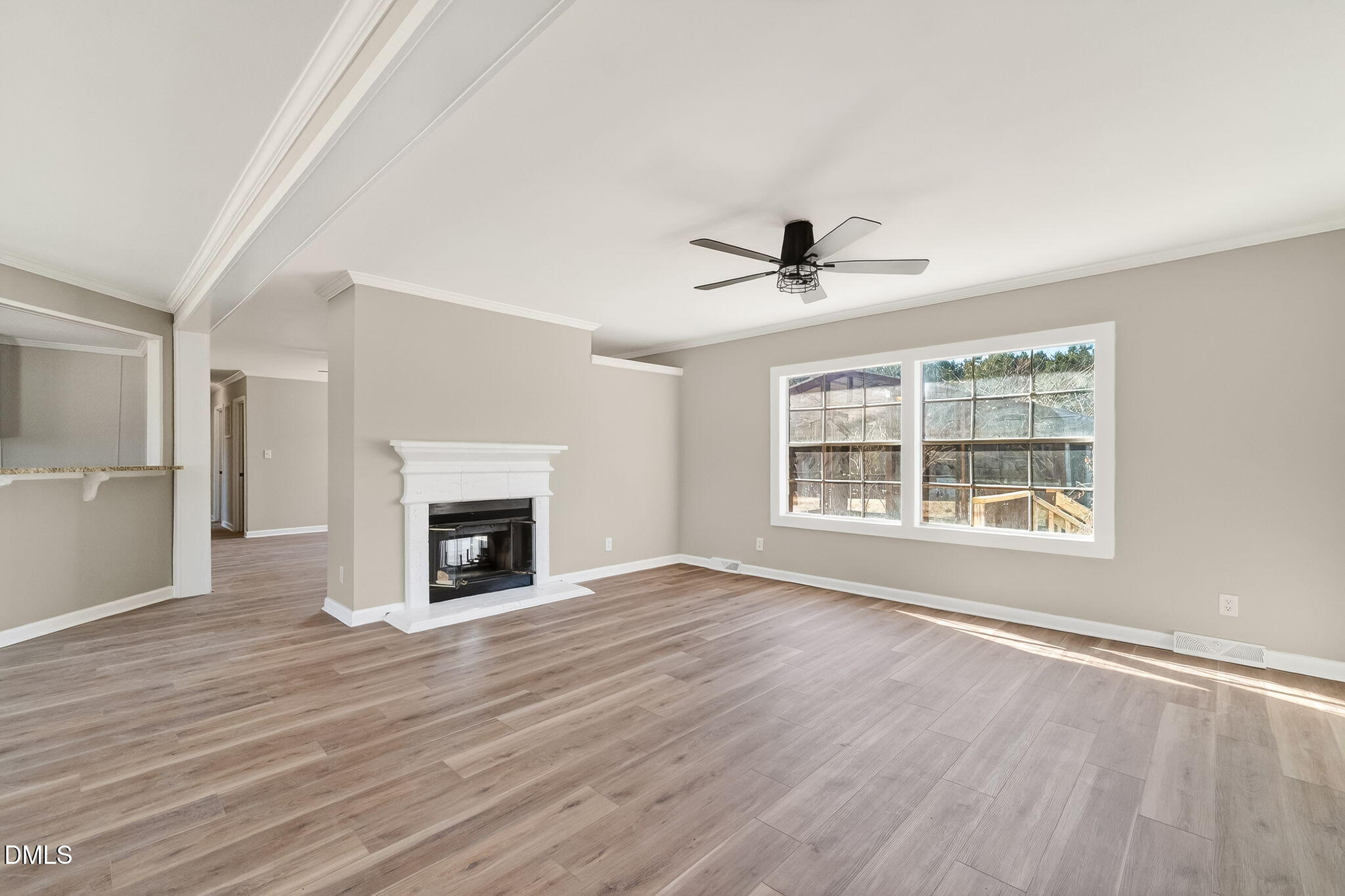 10015 Smith Road Middlesex, NC 27557 - Photo 13 of 48 a view of an empty room with a window and fireplace