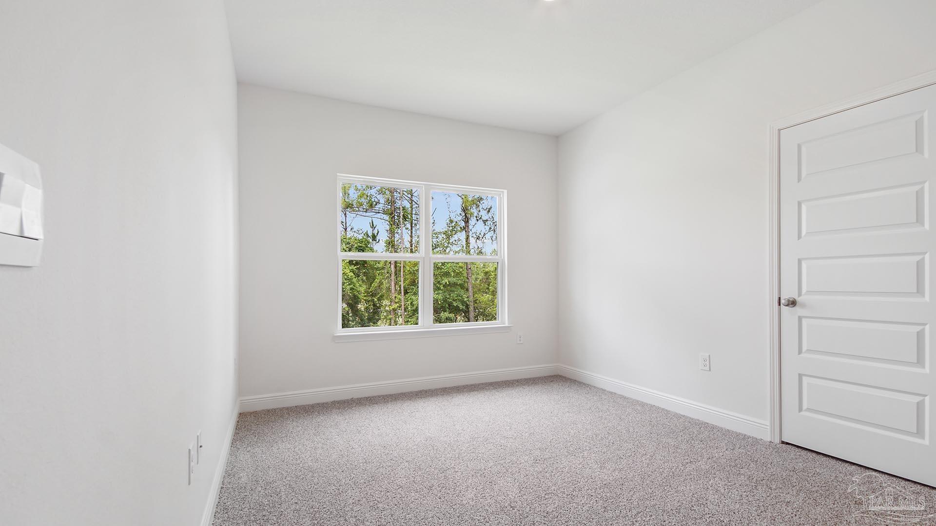 3233 Harrier Road Pace, FL 32571 - Photo 27 of 50 an empty room with windows