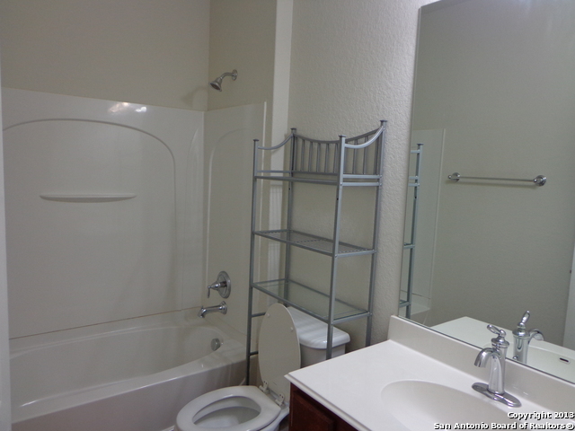 26907 Bluewater Way San Antonio, TX 78260 - Photo 11 of 13 a bathroom with a sink toilet and shower