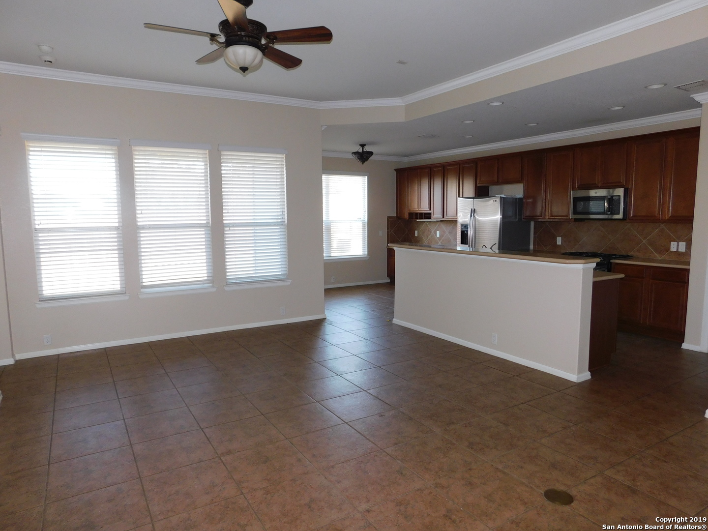 26907 Bluewater Way San Antonio, TX 78260 - Photo 4 of 13 a kitchen with stainless steel appliances granite countertop a stove top oven a sink a counter space and cabinets