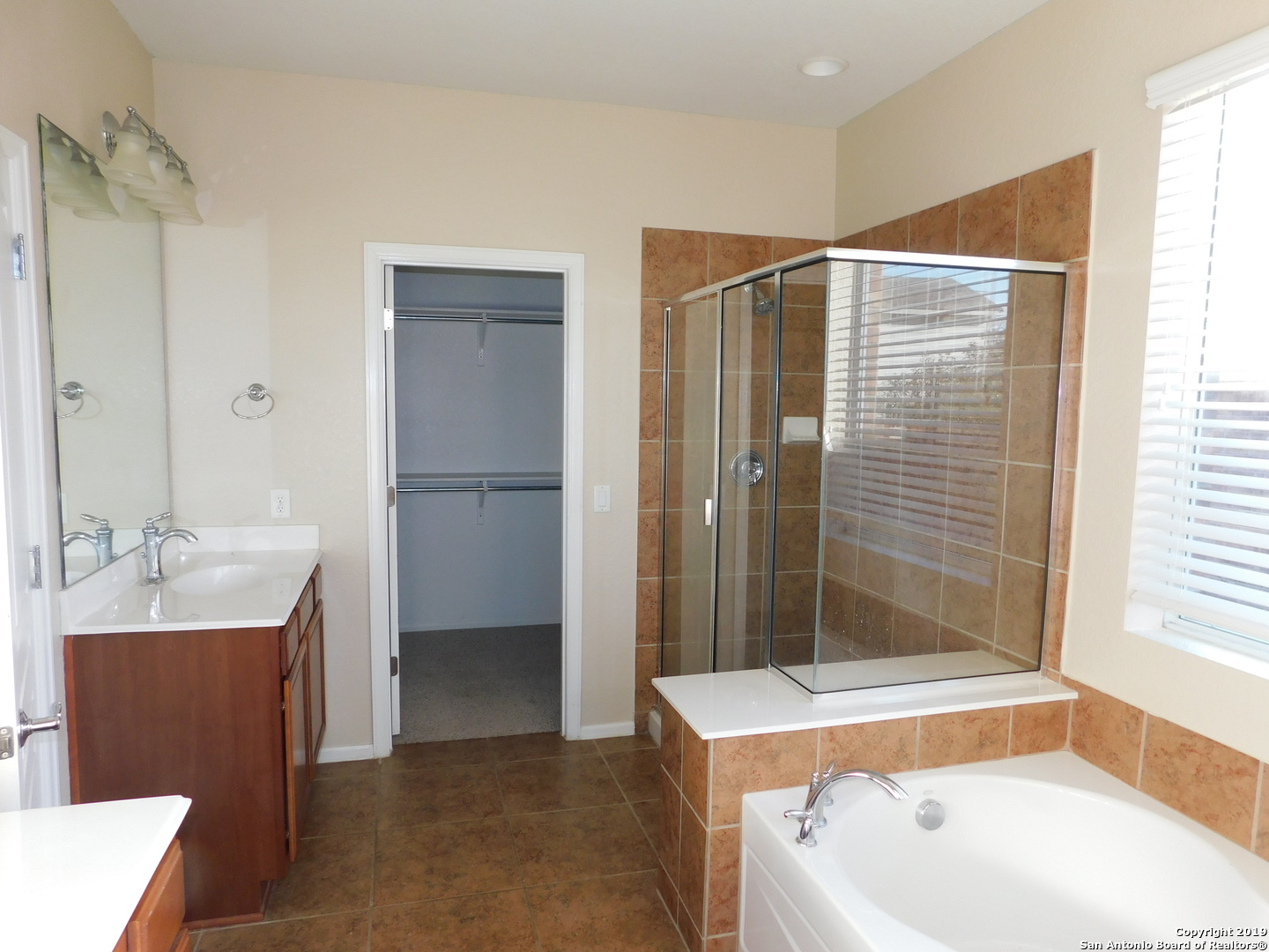 26907 Bluewater Way San Antonio, TX 78260 - Photo 7 of 13 a bathroom with a bathtub and a sink