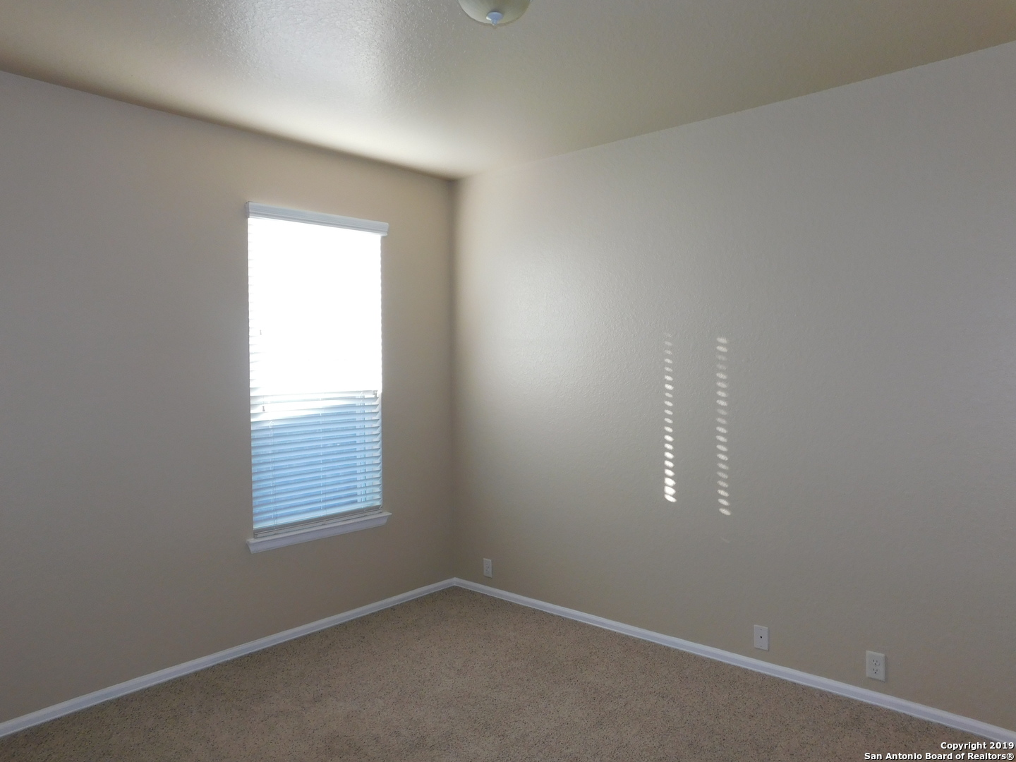 26907 Bluewater Way San Antonio, TX 78260 - Photo 9 of 13 an empty room with a window