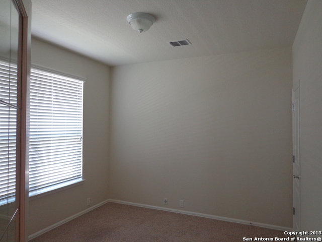 26907 Bluewater Way San Antonio, TX 78260 - Photo 10 of 13 an empty room with a window