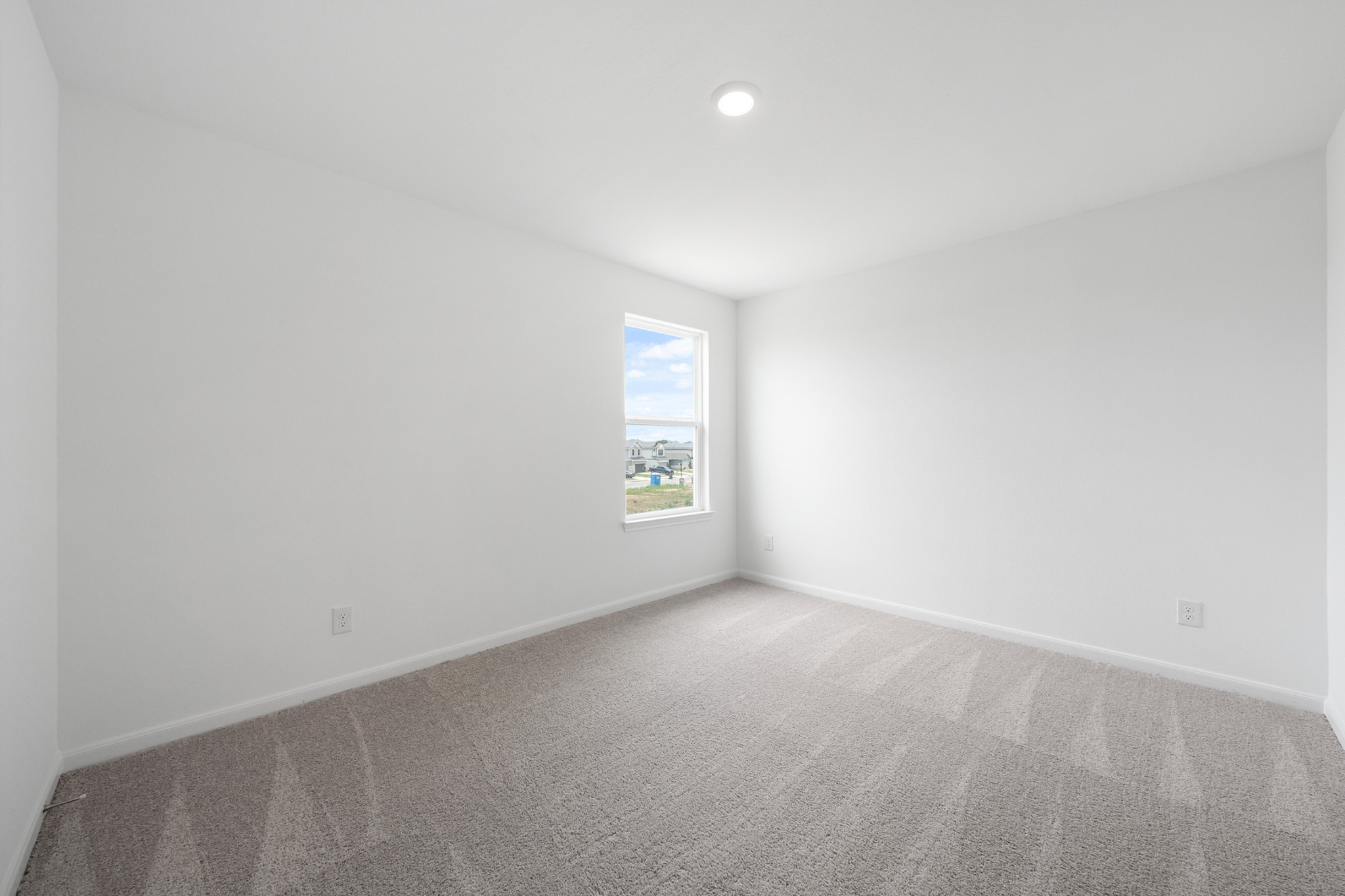 305 Silent Meadow Run Maxwell, TX 78656 - Photo 8 of 13 Spare room featuring light colored carpet and baseboards