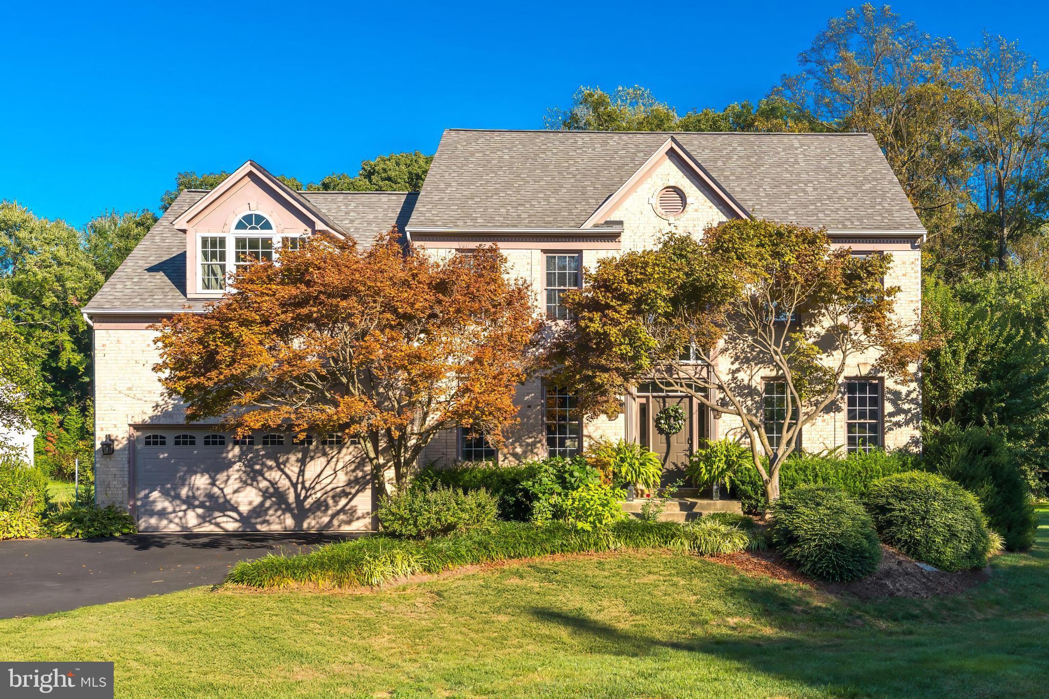 a view of a house with a yard and plants