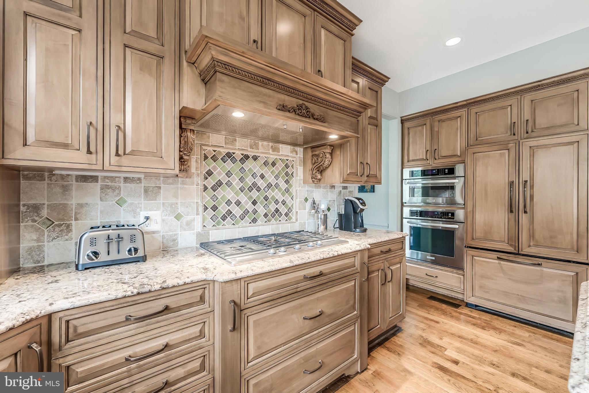 1179 Reston Avenue Herndon, VA 20194 - Photo 17 of 47 a kitchen with stainless steel appliances granite countertop a refrigerator and a stove