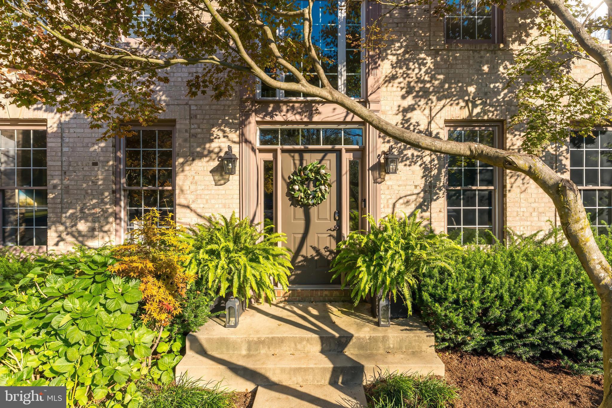 1179 Reston Avenue Herndon, VA 20194 - Photo 2 of 47 a front view of a house with a yard