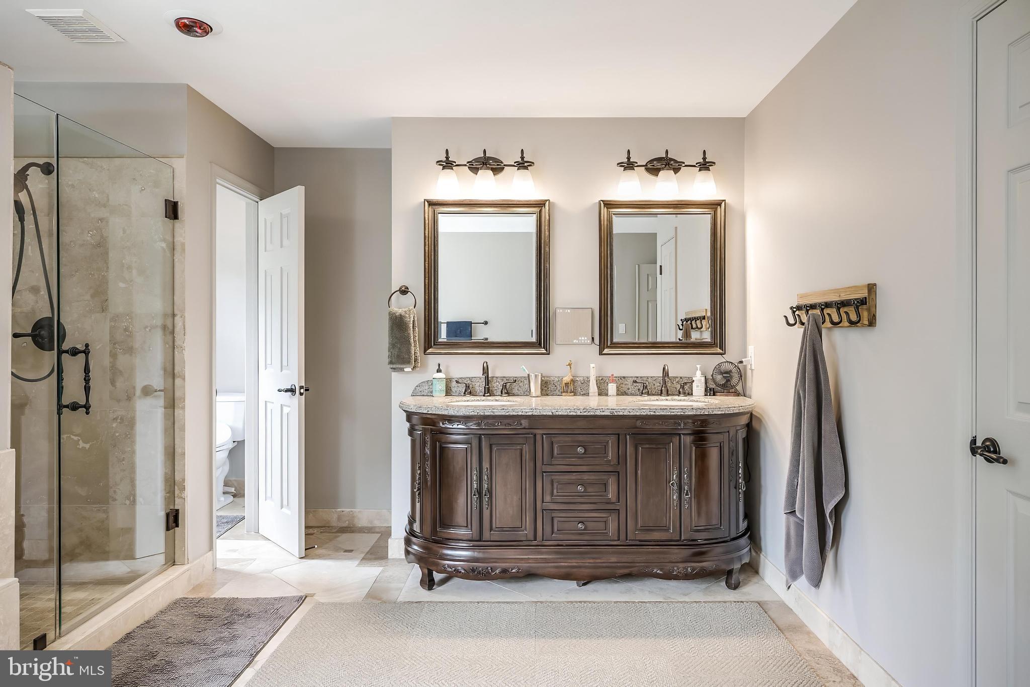 1179 Reston Avenue Herndon, VA 20194 - Photo 24 of 47 a bathroom with a granite countertop sink mirror and shower