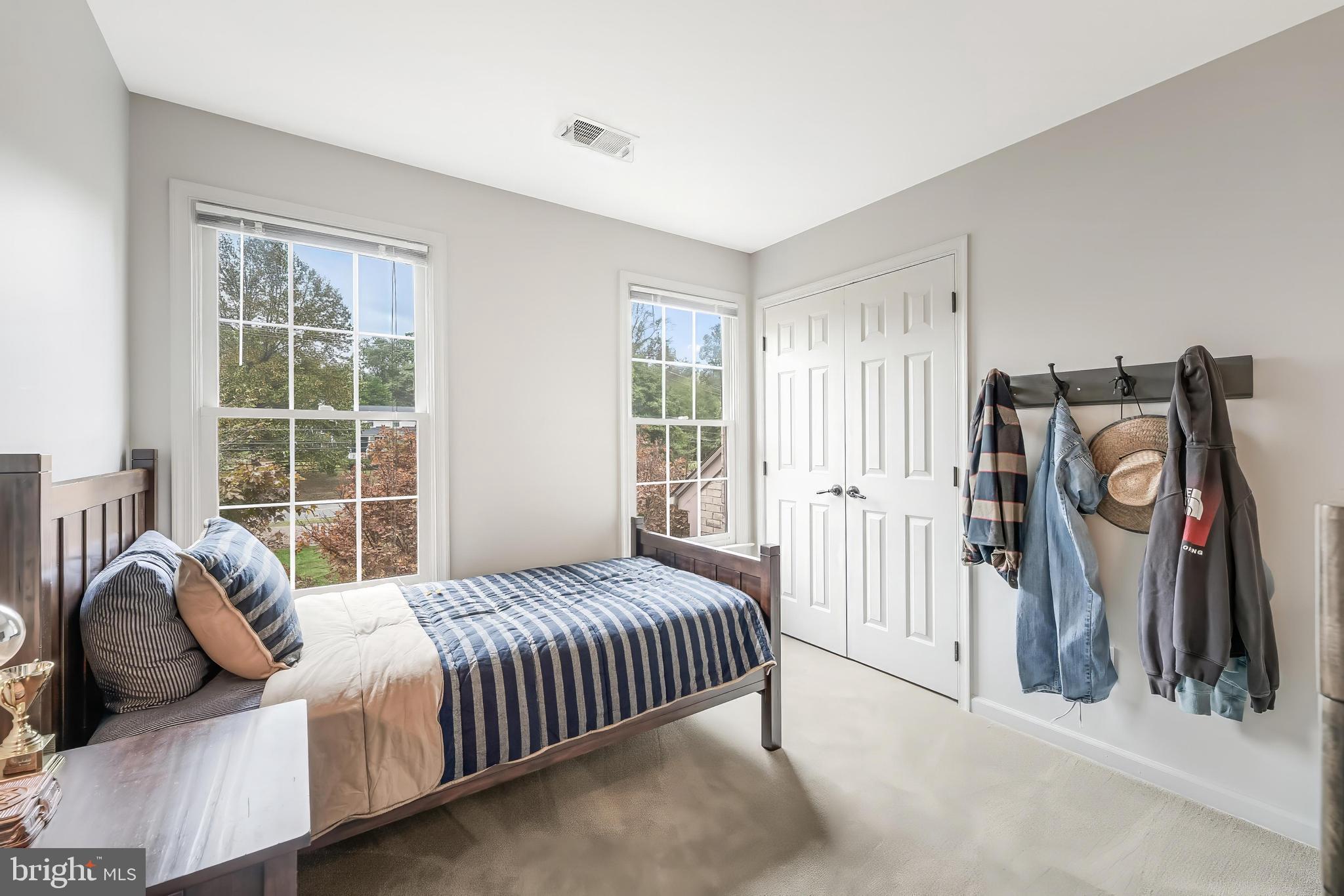 1179 Reston Avenue Herndon, VA 20194 - Photo 26 of 47 a bedroom with a bed next to a window