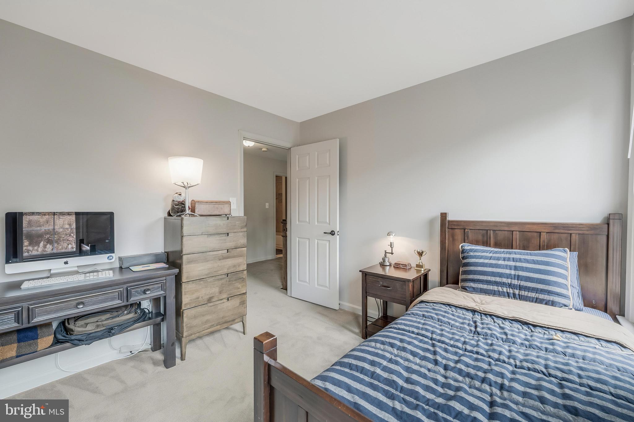 1179 Reston Avenue Herndon, VA 20194 - Photo 27 of 47 a bedroom with furniture and a wooden floor