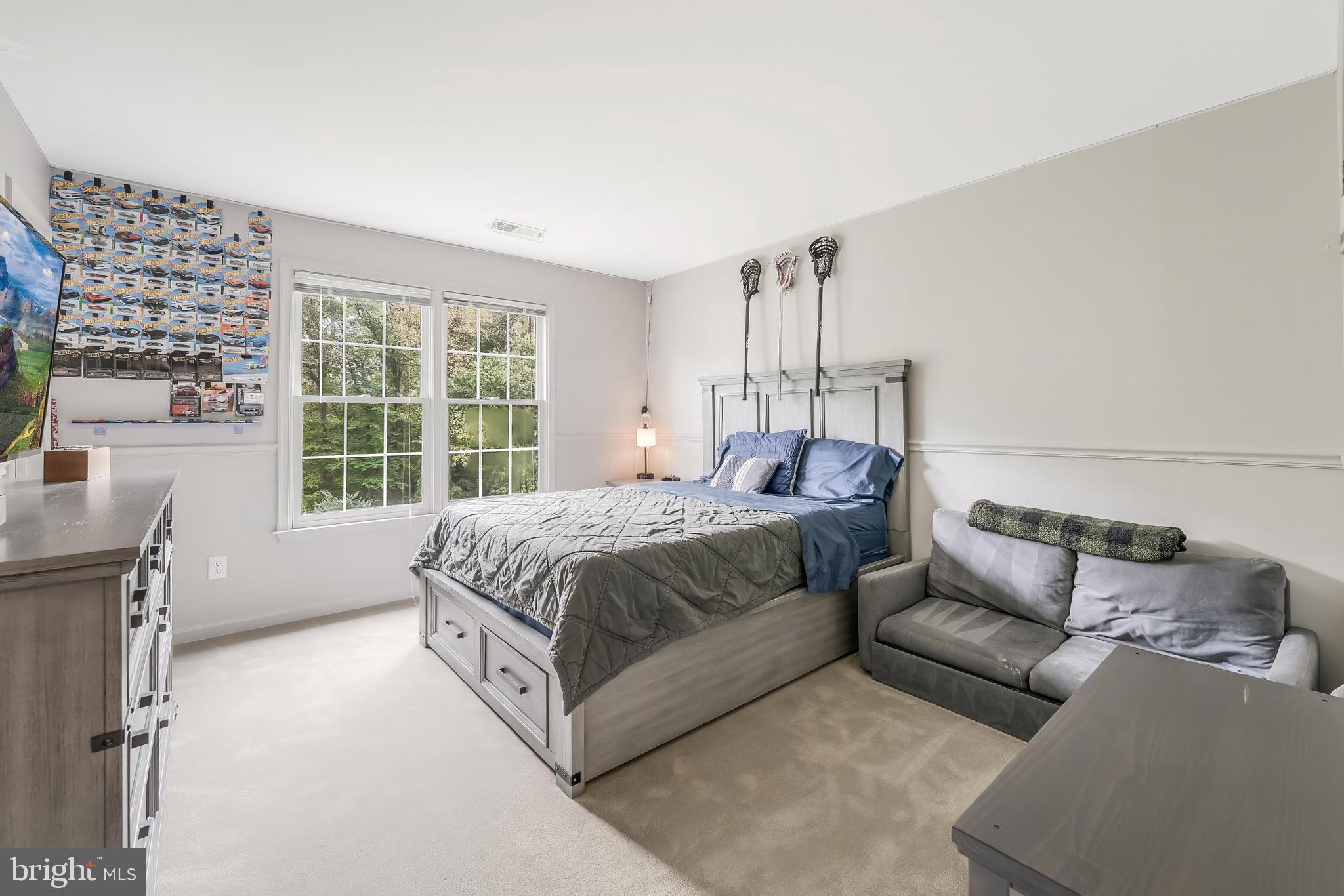 1179 Reston Avenue Herndon, VA 20194 - Photo 29 of 47 a bed room with a bed and a couch