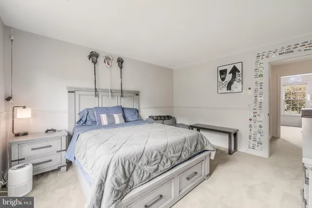 a bedroom with a bed and a fireplace