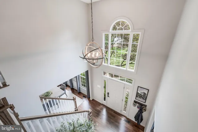 a view of an entryway with wooden floor