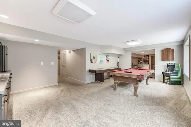 a view of a livingroom with furniture and a flat screen tv
