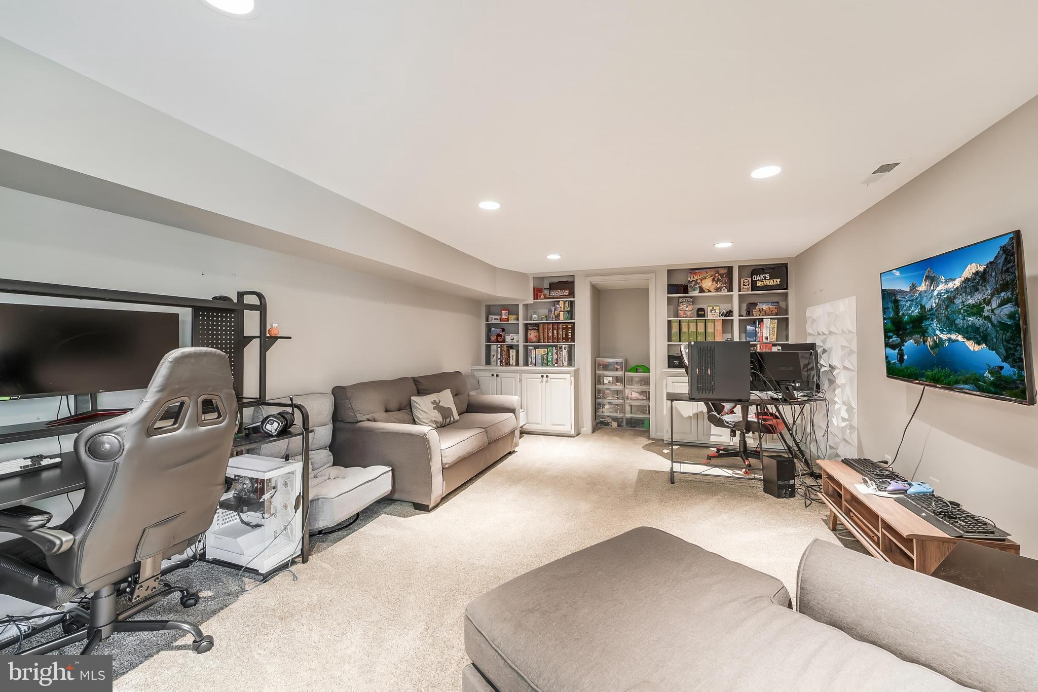1179 Reston Avenue Herndon, VA 20194 - Photo 36 of 47 a living room with furniture and a flat screen tv