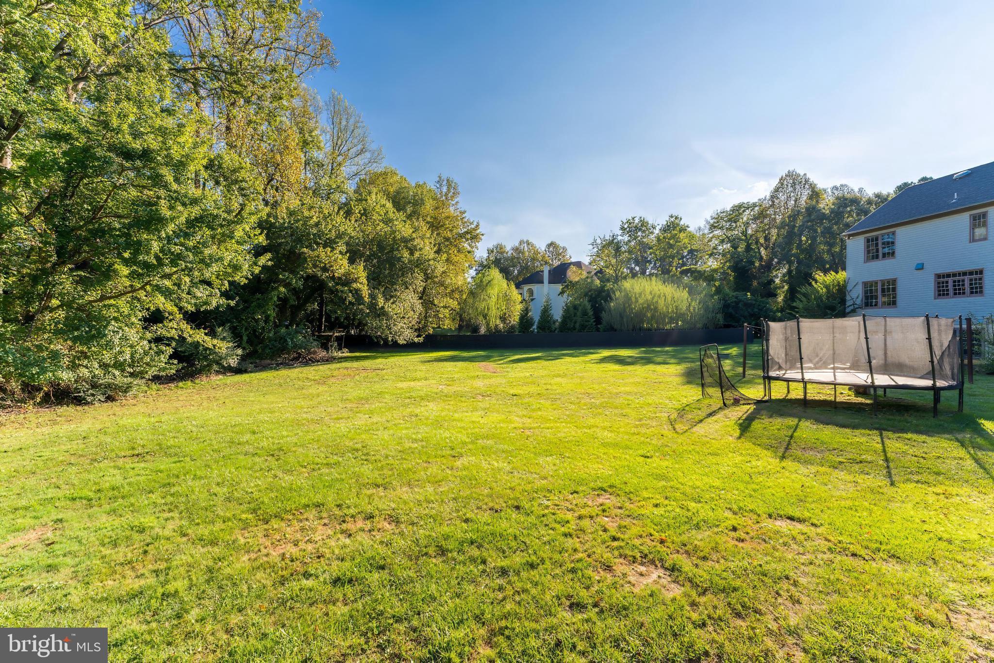 1179 Reston Avenue Herndon, VA 20194 - Photo 43 of 47 a view of a swimming pool with an outdoor seating and a yard