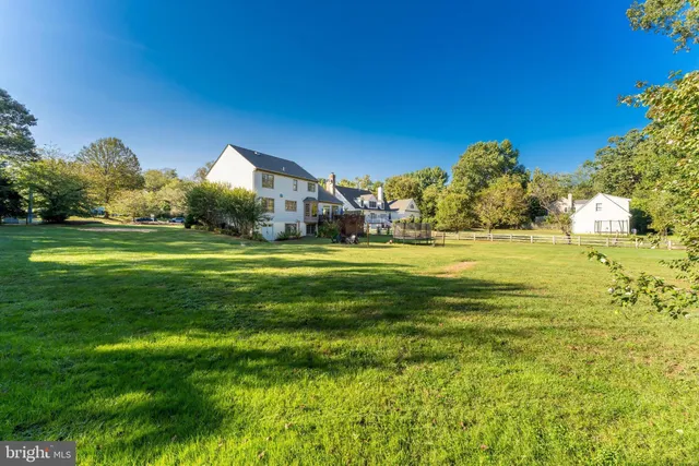 a view of a big yard with a fountain