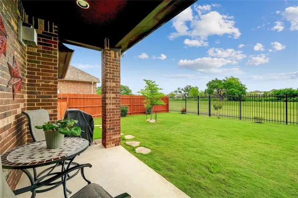 a backyard of a house with lots of green space