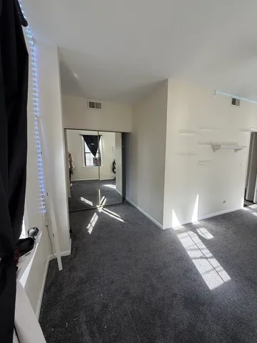 a view of a livingroom with furniture and a flat screen tv