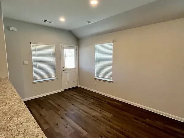 an empty room with windows