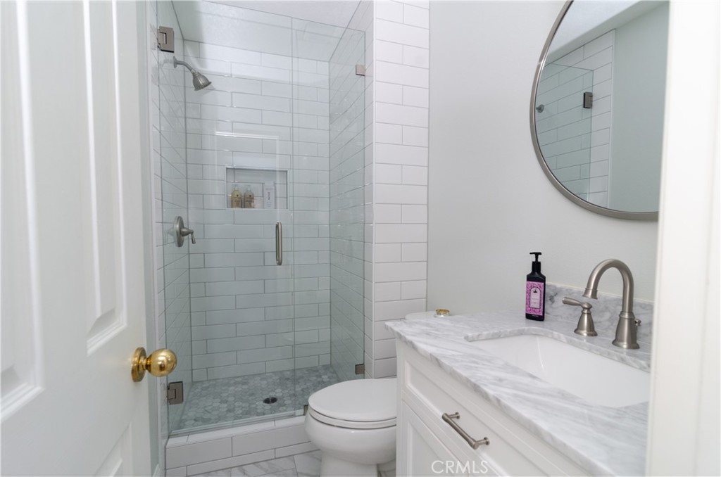 27625 Moonlight Place Castaic, CA 91384 - Photo 24 of 72 a bathroom with a sink toilet and shower