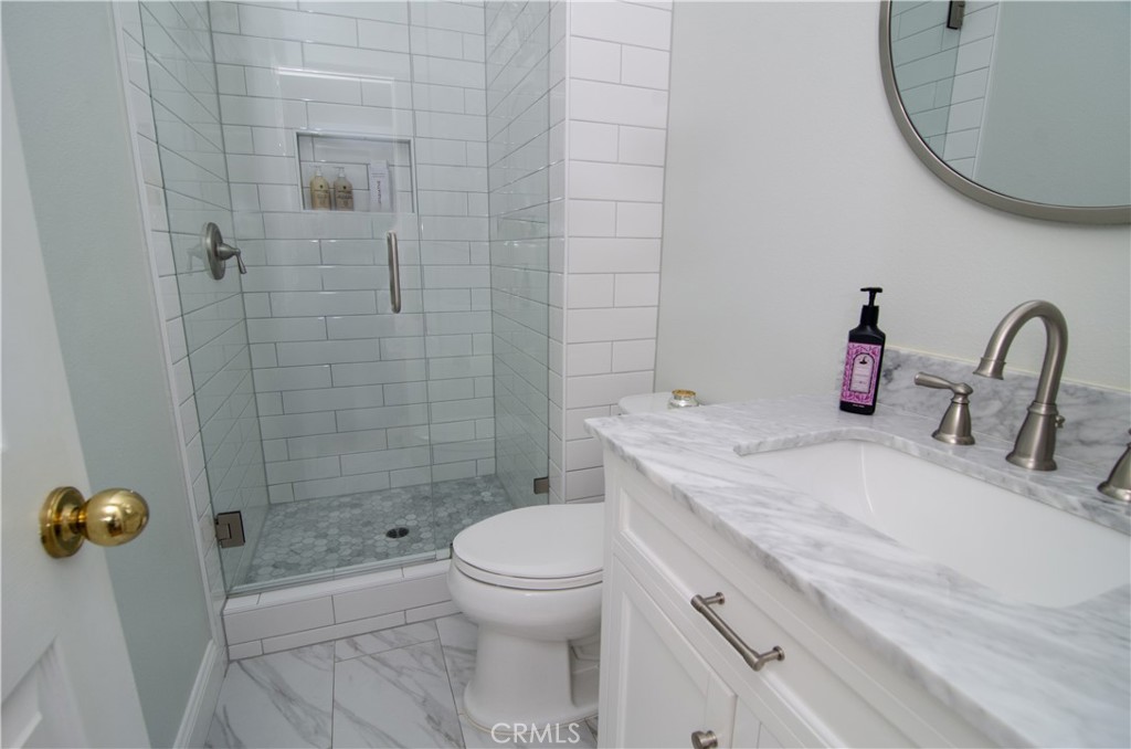 27625 Moonlight Place Castaic, CA 91384 - Photo 25 of 72 a bathroom with a sink a toilet and shower