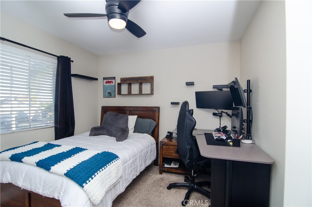27625 Moonlight Place Castaic, CA 91384 - Photo 40 of 72 a bedroom with a bed a desk and chair