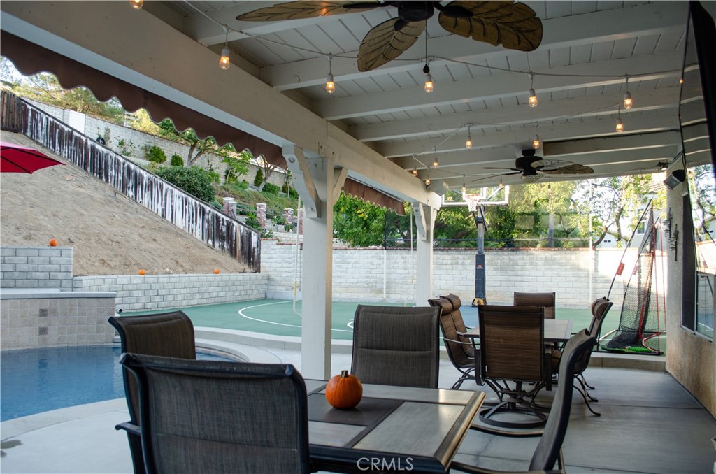 27625 Moonlight Place Castaic, CA 91384 - Photo 49 of 72 Covered patio with ceiling fans and built-in extending shades